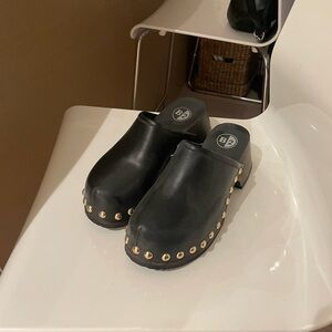 Black studded clogs